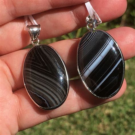 Empowering Divine Purpose: The Life-changing Effects of Crystalized Divine Knowledge Onyx Pendants